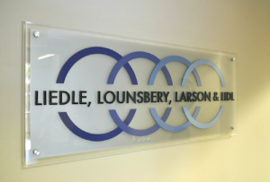 Acrylic plaque with dimensional letters make up this customer lobby sign