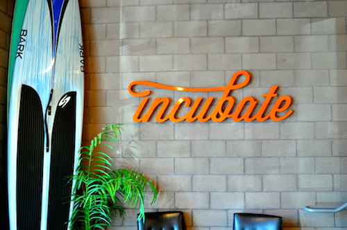 Fabricated aluminum letters and logotype powdercoated and installed on this customer lobby wall
