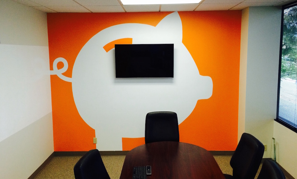 Freshly painted wall graphics of customer logo in conference room