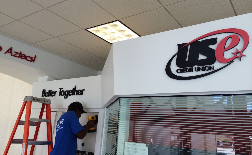 Our crew working on credit union branch rebranding in San Diego