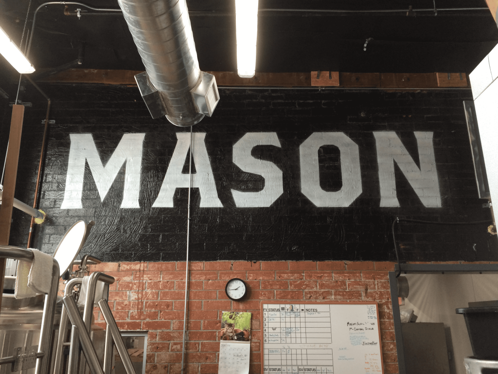 picture of a hand painted wall sign on brick