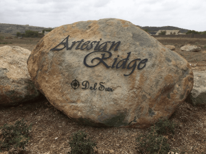 custom aluminum letters mounted to exisitng large boulder monument