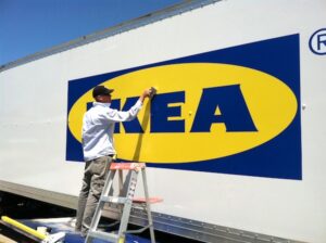 Picture of a large vehicle graphic being installed