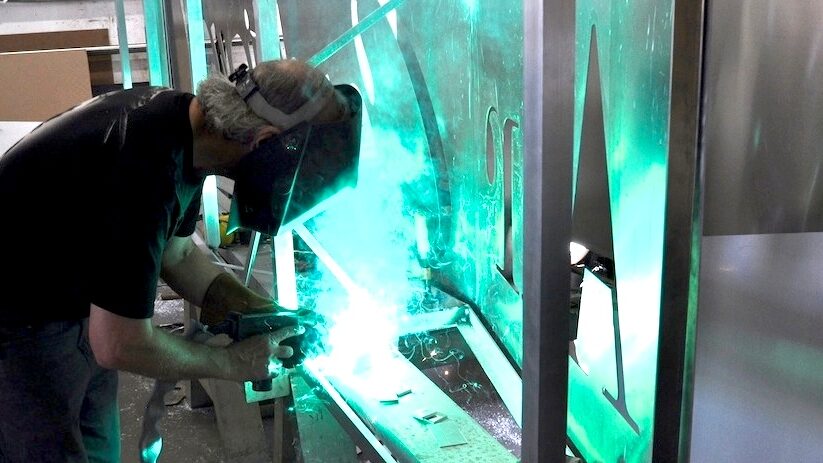 Fabricating a welded sign